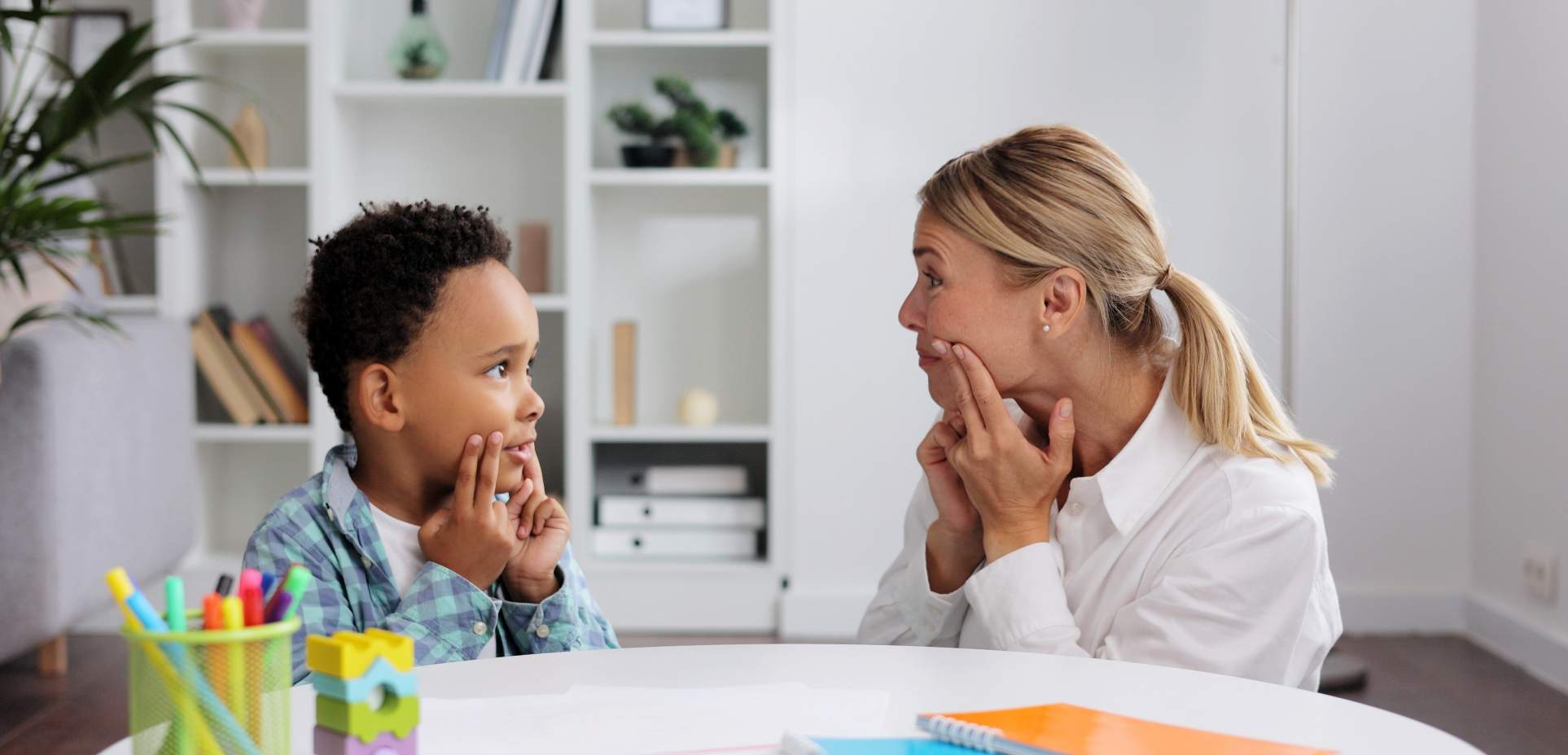 A child playing with a BCBA at Apara Autism Centers