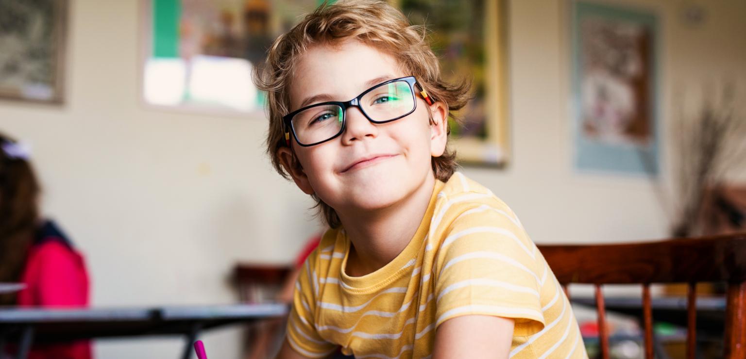 A boy in a yellow shirt