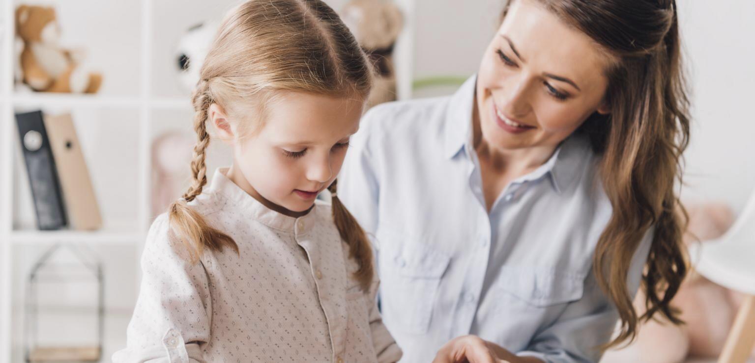 A BCBA playing with a little girl
